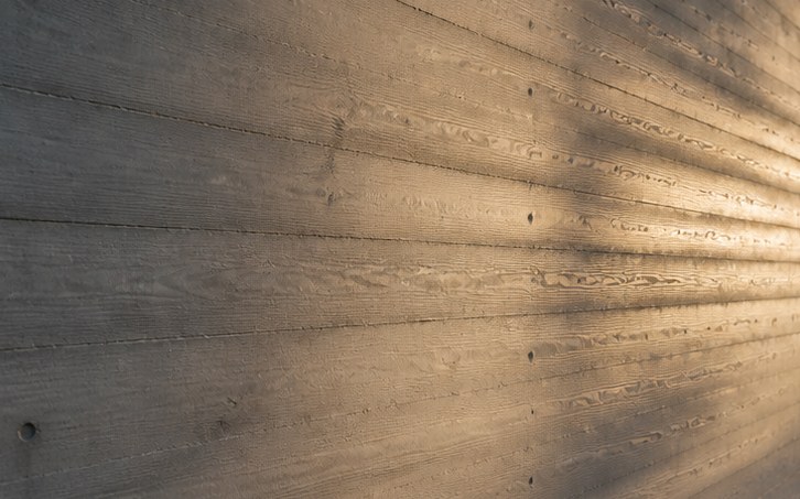 Board-formed concrete wall in raking light