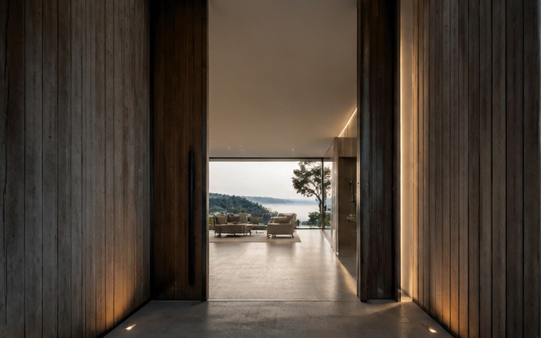 A narrow entry opening into a large room